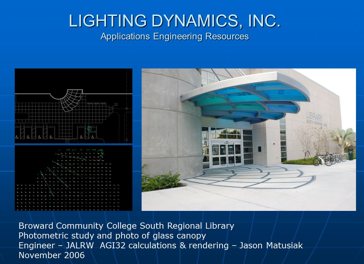 Flood lighting illuminates a glass canopy at the entrance of Broward Community College Library