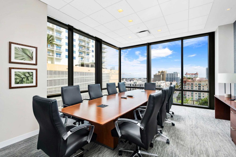 Square downlights installed over a conference table at 360 Rosemary