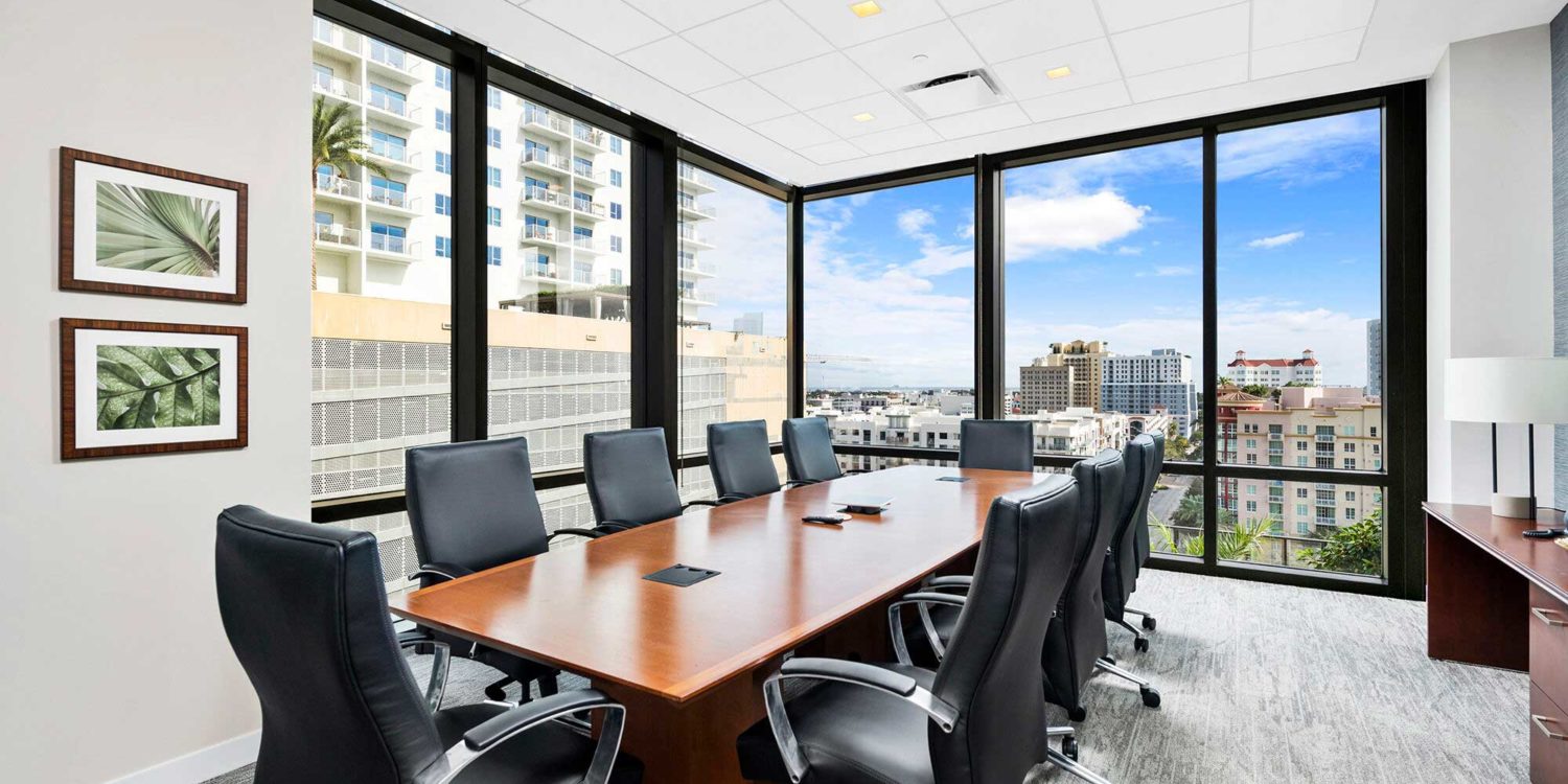 Square downlights installed over a conference table at 360 Rosemary