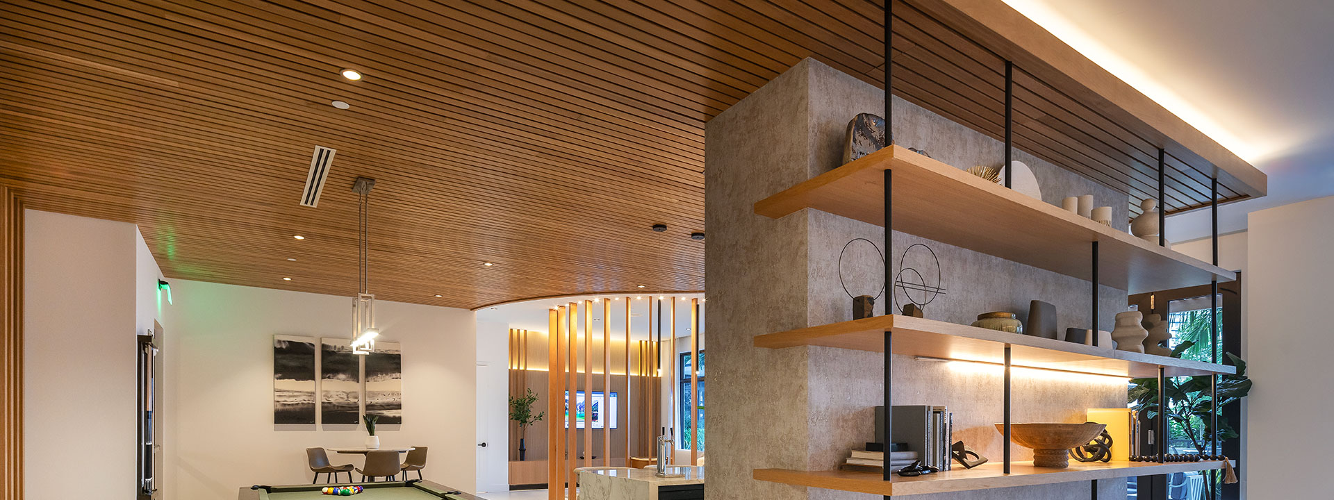 Decorative pendant lighting and cove lighting at Anya